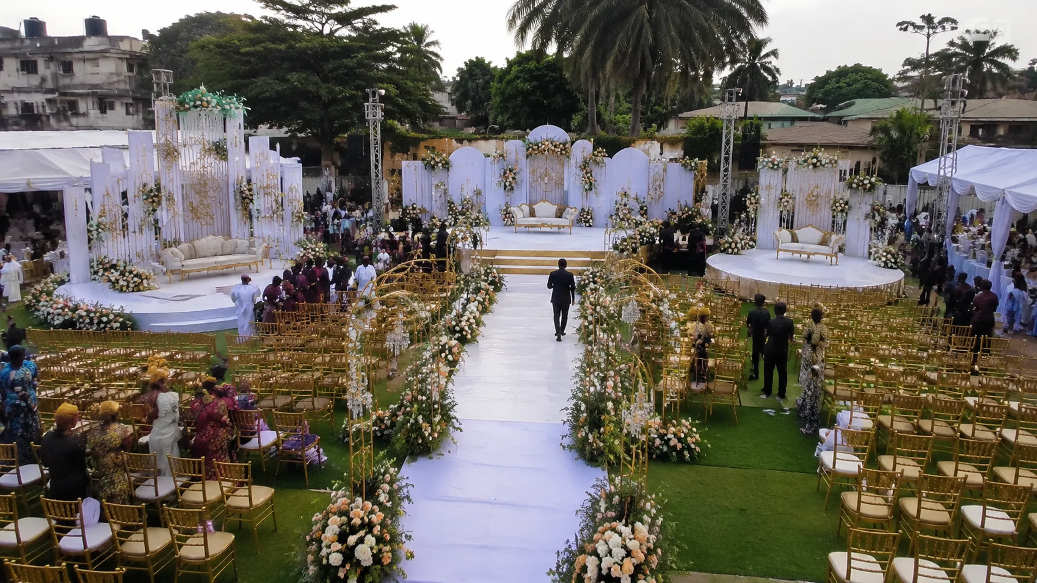 Multicultural wedding ceremony layout showing coordinated seating, family roles, and guest movement
